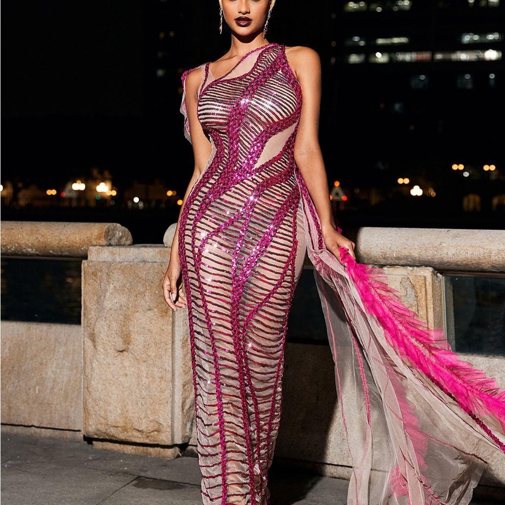Beautiful unique dress! Never worn! You WILL stand out in the dress.